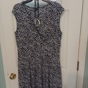 Elegant Black and White Patterned Dress With Necklace.